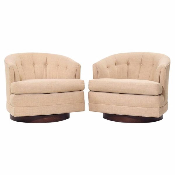 selig mid century walnut base swivel lounge chairs - pair