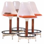 eero saarinen style burke mid century walnut and fiberglass barstools - set of 4